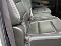 Interior view of a 2017 Chevrolet Silverado 1500 showing the backseat with black leather upholstery and seat belts