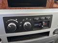 Dashboard controls of a 2006 Dodge Ram 2500 featuring climate control dials and buttons for air conditioning and vents