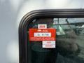 A 2008 Kenworth T370 side window displaying a British Columbia certificate of approval sticker with the expiration date and month listed