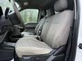 Interior of a 2020 Ford F-550 featuring a two-tone cloth seat design with a driver's seat and passenger seat visible in light gray fabric
