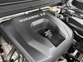 Close-up of the engine cover of a 2017 Chevrolet Colorado featuring the Duramax 28 insignia and engine components