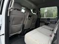 Interior view of the backseat of a 2020 Ford F-550 showing gray fabric seats and a spacious layout