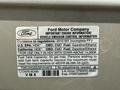 A label from a 2012 Ford Econoline E-450 detailing important engine information and fuel specifications