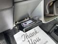 A dashboard control unit for a 2018 Ford F-750 is mounted on the side of the console with a small display and buttons