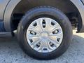 A close-up of a wheel featuring a silver multi-spoke rim and a black tire with the brand name Whankook visible on the sidewall