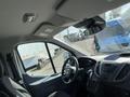 Interior view of a 2017 Ford Transit showing the driver's seat dashboard and steering wheel