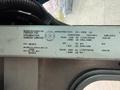2012 Ford Econoline with a manufacturer's label detailing specifications including weight and tire information