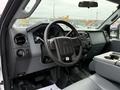 Interior of a 2015 Ford F-350 SD showing the steering wheel dashboard and center console