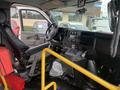 Interior view of a 2020 Chevrolet Express showing the driver's seat dashboard controls and steering wheel