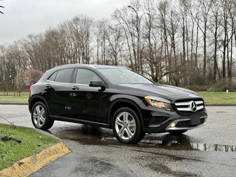 A black 2016 Mercedes-Benz GLA-250 parked on the roadside with a sleek design and modern features