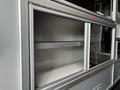 Interior storage compartments of a 2020 Mercedes-Benz Sprinter 2500 featuring metal frames and empty shelves