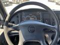 Steering wheel and dashboard of a 2007 Freightliner M2 106 with gauges and controls visible