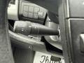 A close-up of the cruise control lever in a 2020 RAM Promaster showing buttons for set cancel resume and on off