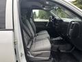 Interior view of a 2016 GMC Sierra 1500 featuring gray seats and dashboard with air vents and controls visible