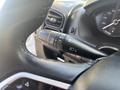 Close-up of the turn signal and headlight control lever on the steering column of a 2022 RAM Promaster 350