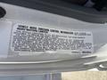 Label providing vehicle noise emission control information for a 2022 Isuzu NRR
