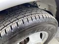 Close-up of a tire from a 2020 Chevrolet Express displaying tread patterns and the brand name on the sidewall