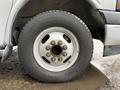 Close-up of a tire and wheel assembly from a 2020 Chevrolet Express showcasing the wheel rim and lug nuts