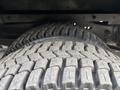 Close-up of a tire from a 2018 Ford Econoline showcasing the tread pattern and rubber texture