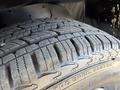 Close-up view of a tire on a 2020 Chevrolet Express showing the tread pattern and markings on the sidewall