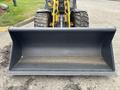Front view of a Wacker Neuson WL34 bucket with a wide open scoop ready for earthmoving or loading materials