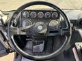 Interior view of a 2011 Autocar Xpeditor's dashboard showing a steering wheel and various gauges
