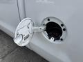 A 2018 Chevrolet Silverado 1500 with its fuel door open revealing the fuel tank inlet