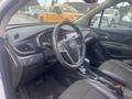Interior view of a 2018 Buick Encore showing the steering wheel dashboard center console and seats