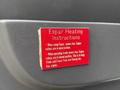 Red instruction label for Espar heating system on a vehicle door with details about engine valve positions