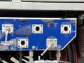 A control panel with multiple valves and switches labeled for various functions including fill air reservoir hydro excavator system and fan housing washout