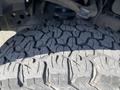 Close-up of a treaded tire from a 2018 Ford F-150 showcasing deep grooves and rugged pattern for off-road traction