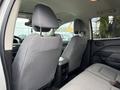 Interior view of a 2018 Chevrolet Colorado showing front seats and backrest with a center console between the front seats