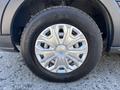 Close-up of a silver alloy wheel with a Hankook tire from a 2016 Ford Transit 150