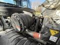 Close-up view of the engine compartment of a 2010 International 4300 featuring the air intake system and various engine components