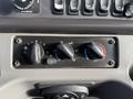 Control panel with three knobs for fan speed and temperature settings in a 2015 Freightliner M2