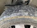 Close-up of a worn tire from a 2009 Dodge Ram 5500 showing tread patterns and dirt accumulation