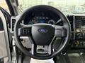 Steering wheel of a 2017 Ford F-450 Super Duty featuring the Ford logo and various controls