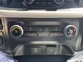 Control panel of a 2021 Ford F-150 featuring climate control knobs buttons for air conditioning and USB ports