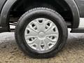 Wheel of a 2020 Ford Transit featuring a silver rim and black tire with distinct tread pattern