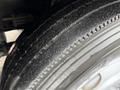 Close-up of a tire from a 2009 UD Trucks UD 3300 showing tread patterns and surface wear
