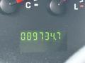 A digital odometer display showing the mileage of 89734.7 on a 2007 Ford E-350