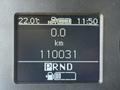 A digital dashboard display showing a temperature of 22 degrees Celsius a trip distance of 0 km a total distance of 110031 km and a gear indicator with positions P R N D