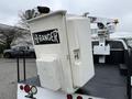 A bucket lift attachment labeled Hi-Ranger mounted on the bed of a 2012 Ford F-450 Super Duty truck