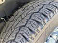 Close-up of a treaded tire from a 2019 GMC Savana showcasing detailed tread patterns designed for improved traction on various surfaces