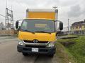 A yellow 2019 Hino 155 box truck facing forward with a visible front grille and headlights