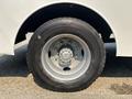 A close-up view of a 2006 Sterling Acterra tire mounted on a wheel rim with a silver hub and black treaded rubber surface