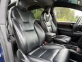 Interior view of a 2020 Tesla Model X featuring two black leather front seats with a minimalist design and adjustable headrests