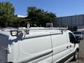 A 2016 Ford Transit van with a white exterior and roof racks for transporting equipment or cargo