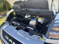 A 2020 RAM ProMaster 3500 with its hood open displaying the engine compartment including various fluid reservoirs and engine components