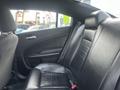 The interior of a 2015 Dodge Charger featuring black leather seating and a sleek design